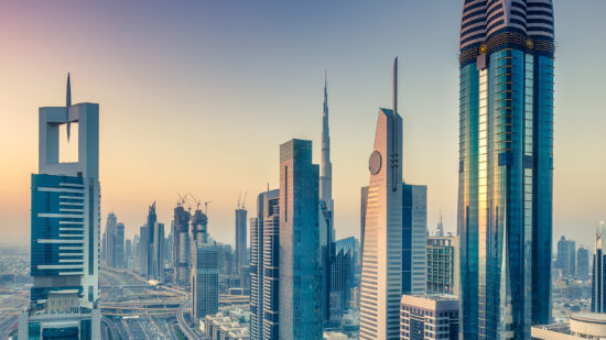 Skyscrapers and highways of downtown Dubai, United Arab Emirates, at sunset